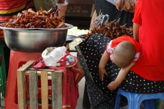 Sleeping baby in a station, Myanmar